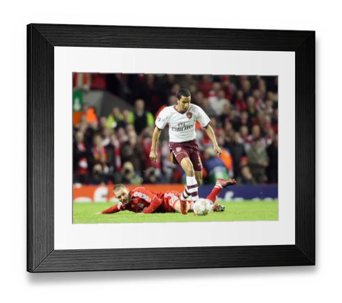 Framed Print : Determined Theo Walcott: Arsenal's Champions League Moment vs. Liverpool - Overcoming Fabio Aurelio to Set Up Adebayor's Goal Framed Print : Determined Theo Walcott: Arsenal's Champions League Moment vs. Liverpool - Overcoming Fabio Aurelio to Set Up Adebayor's Goal