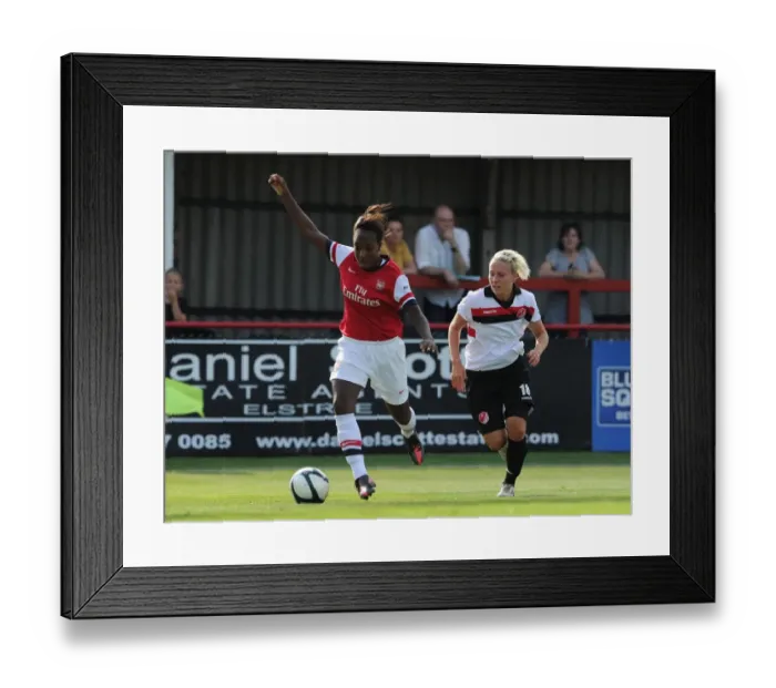 Framed Print : Arsenal vs. Lincoln Ladies: A Battle of Skills - Danielle Carter vs. Sophie Baker in the FA WSL