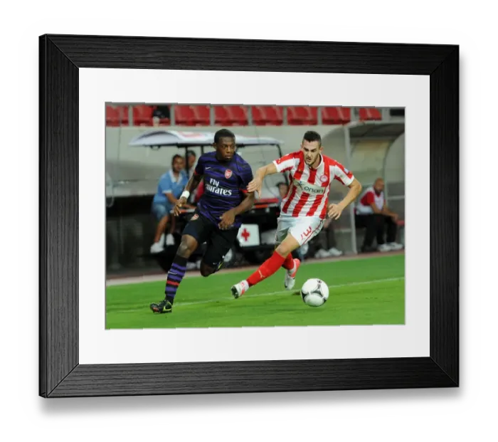 Framed Print : Anthony Jeffrey vs. Charalampos Lykogiannis: Tense Moment in Olympiacos vs. Arsenal NextGen Series Match