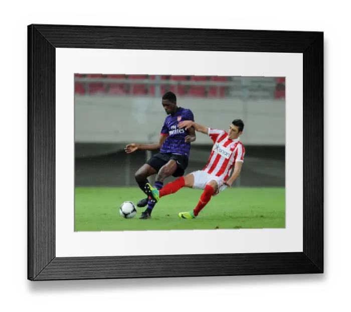 Framed Print : Clash of Young Talents: Elton Monteiro vs. Nikos Ioannidis - Olympiacos vs. Arsenal, NextGen Series