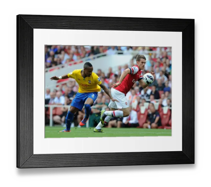 Framed Print : Arsenal's Dominant Performance: Aaron Ramsey Scores Brace in 6-1 Rout against Southampton (Premier League, 2012-13)