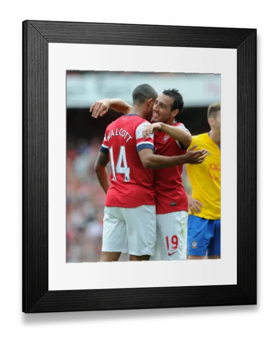 Framed Print : Theo Walcott celebrates scoring the 6th Arsenal goal with Santi Cazorla Framed Print : Theo Walcott celebrates scoring the 6th Arsenal goal with Santi Cazorla