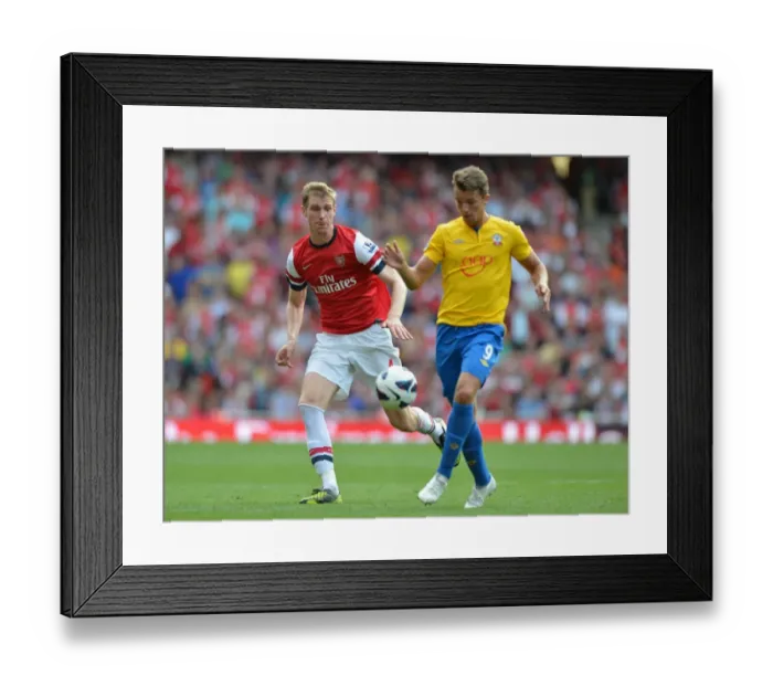 Framed Print : Arsenal's Dominant Victory: Per Mertesacker Scores in Arsenal 6-1 Southampton (Premier League, 2012-13)