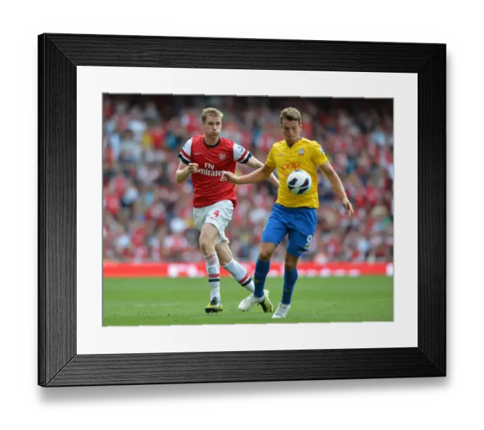 Framed Print : Arsenal's Dominant Victory: Per Mertesacker Scores in Arsenal's 6-1 Thrashing of Southampton (Premier League, 2012-13) Framed Print : Arsenal's Dominant Victory: Per Mertesacker Scores in Arsenal's 6-1 Thrashing of Southampton (Premier League, 2012-13)