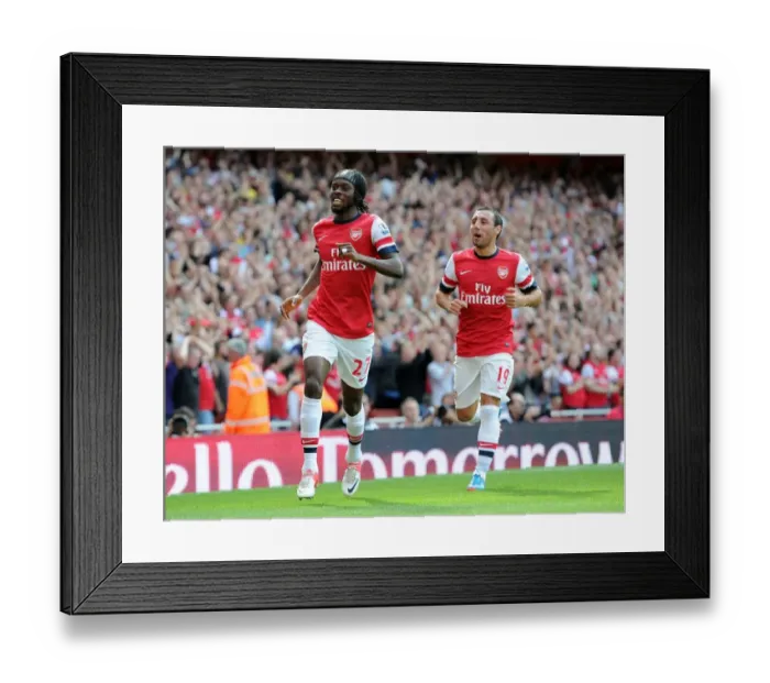 Framed Print : Arsenal's Dominant Performance: Gervinho and Cazorla Celebrate Arsenal's First Goal in 6-1 Victory over Southampton Framed Print : Arsenal's Dominant Performance: Gervinho and Cazorla Celebrate Arsenal's First Goal in 6-1 Victory over Southampton