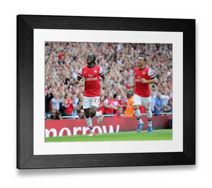 Framed Print : Arsenal's Dominant Display: Gervinho and Cazorla's Jubilant Celebration - Arsenal 6:1 Southampton (Premier League, Emirates Stadium, September 15, 2012)