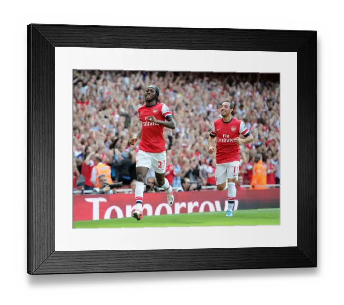 Framed Print : Arsenal's Dominant Performance: Gervinho and Cazorla's Unforgettable 6-1 Goal Celebration vs. Southampton