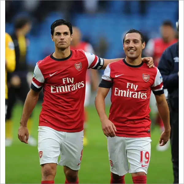 Unity Reigns: Arteta and Cazorla's Post-Match Moment (Manchester City vs. Arsenal, 2012-13)