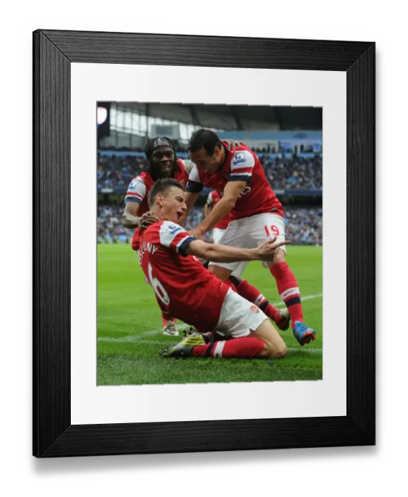 Framed Print : Arsenal's Koscielny, Cazorla, and Gervinho Celebrate Goal Against Manchester City Framed Print : Arsenal's Koscielny, Cazorla, and Gervinho Celebrate Goal Against Manchester City