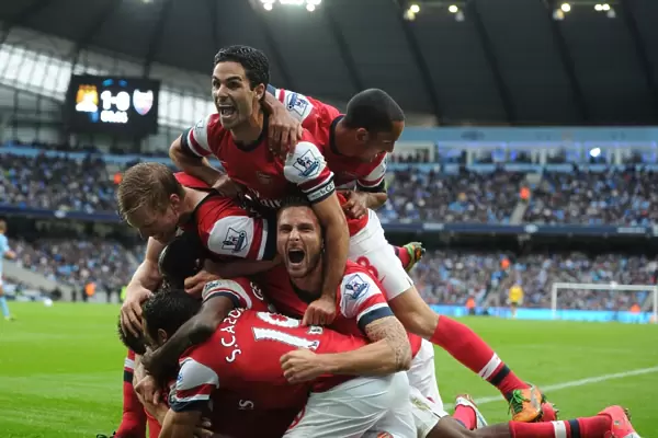 Arsenal's Unforgettable Moment: Koscielny's Goal Celebration with Team Mates Mertesacker, Gervinho, Cazorla, Arteta, Walcott, and Giroud
