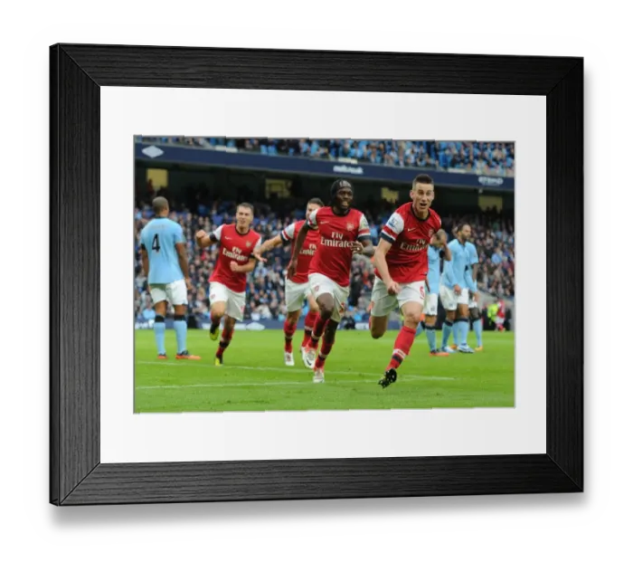 Framed Print : Arsenal's Koscielny, Giroud, Ramsey, and Gervinho Celebrate Goal Against Manchester City (2012-13) Framed Print : Arsenal's Koscielny, Giroud, Ramsey, and Gervinho Celebrate Goal Against Manchester City (2012-13)