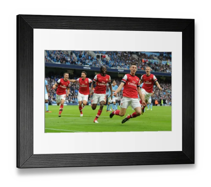 Framed Print : Unstoppable Foursome: Arsenal's Epic Goal Celebration - Koscielny, Giroud, Ramsey, and Mertesacker vs. Manchester City (2012-13)