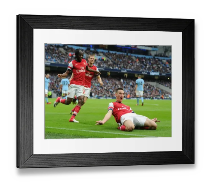 Framed Print : Arsenal's Koscielny, Mertesacker, and Gervinho Celebrate Goal Against Manchester City Framed Print : Arsenal's Koscielny, Mertesacker, and Gervinho Celebrate Goal Against Manchester City