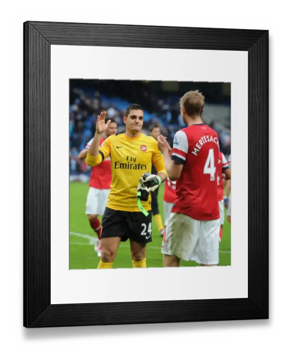 Framed Print : Mannone and Mertesacker: Arsenal's Defensive Duo After Manchester City Showdown (2012-13) Framed Print : Mannone and Mertesacker: Arsenal's Defensive Duo After Manchester City Showdown (2012-13)