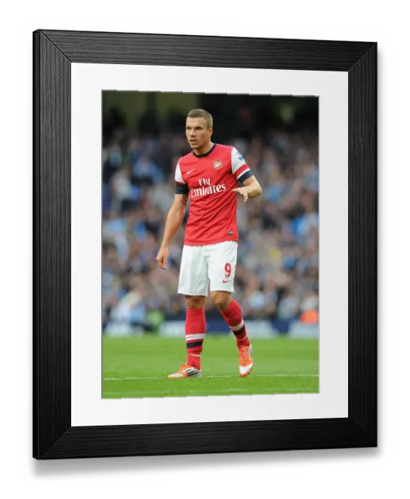 Framed Print : Lukas Podolski Faces Manchester City: Premier League Showdown (2012-13) Framed Print : Lukas Podolski Faces Manchester City: Premier League Showdown (2012-13)
