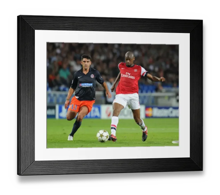 Framed Print : Abou Diaby vs. Marco Estrada: A Battle in the UEFA Champions League - Arsenal's Diaby Outmaneuvers Montpellier's Defender Framed Print : Abou Diaby vs. Marco Estrada: A Battle in the UEFA Champions League - Arsenal's Diaby Outmaneuvers Montpellier's Defender