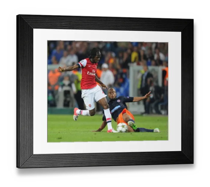 Framed Print : Gervinho vs. Bocaly: Montpellier vs. Arsenal, UEFA Champions League, 2012-13