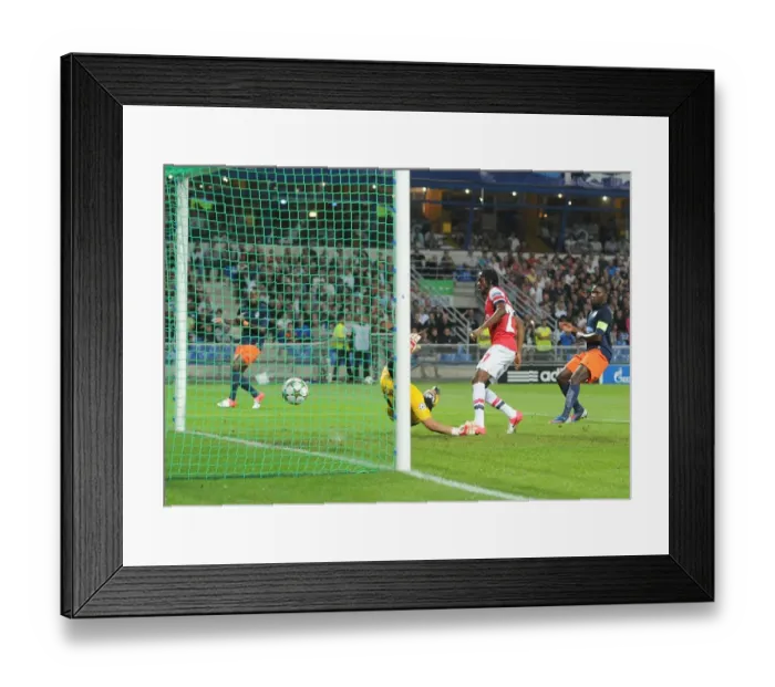 Framed Print : Gervinho Scores Past Jourden: Montpellier vs. Arsenal, UEFA Champions League 2012