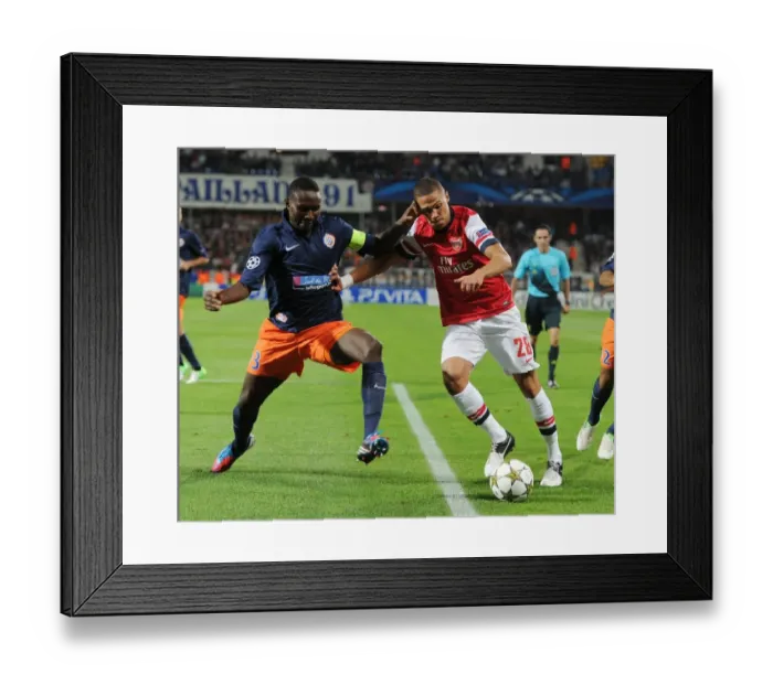 Framed Print : Clash of Defenders: Gibbs vs. Yanga-Mbiwa - Montpellier vs. Arsenal, UEFA Champions League, 2012