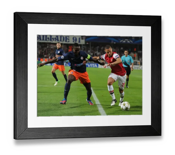 Framed Print : Clash of Defenders: Gibbs vs. Yanga-Mbiwa - Montpellier vs. Arsenal, UEFA Champions League, 2012