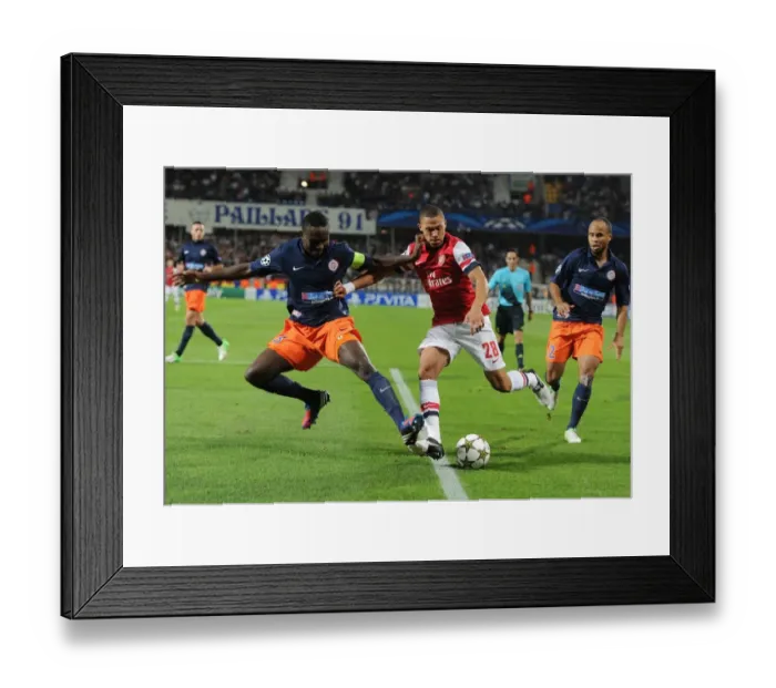 Framed Print : Clash of Defenders: Gibbs vs. Yanga-Mbiwa - Montpellier vs. Arsenal, UEFA Champions League, 2012 Framed Print : Clash of Defenders: Gibbs vs. Yanga-Mbiwa - Montpellier vs. Arsenal, UEFA Champions League, 2012