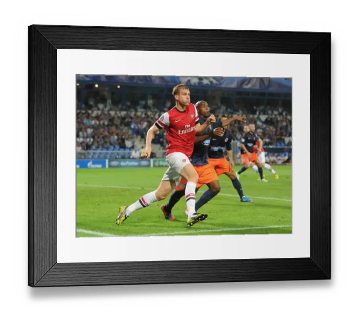Framed Print : Per Mertesacker vs. Suleyman Camara: A Battle in the UEFA Champions League (Montpellier v Arsenal 2012-13) Framed Print : Per Mertesacker vs. Suleyman Camara: A Battle in the UEFA Champions League (Montpellier v Arsenal 2012-13)
