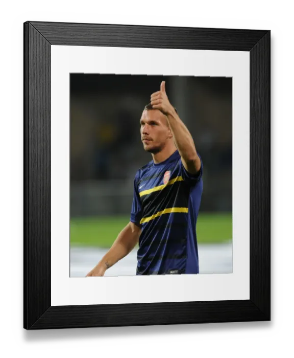 Framed Print : Lukas Podolski: Arsenal Star's Pre-Match Focus at Montpellier, 2012-13 UEFA Champions League Framed Print : Lukas Podolski: Arsenal Star's Pre-Match Focus at Montpellier, 2012-13 UEFA Champions League
