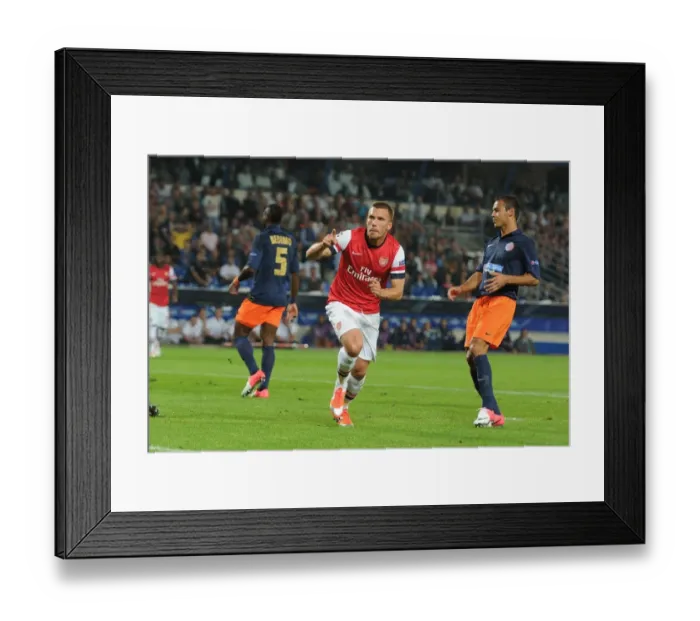 Framed Print : Lukas Podolski Scores First Arsenal Goal in Montpellier Victory, 2012-13 UEFA Champions League Framed Print : Lukas Podolski Scores First Arsenal Goal in Montpellier Victory, 2012-13 UEFA Champions League