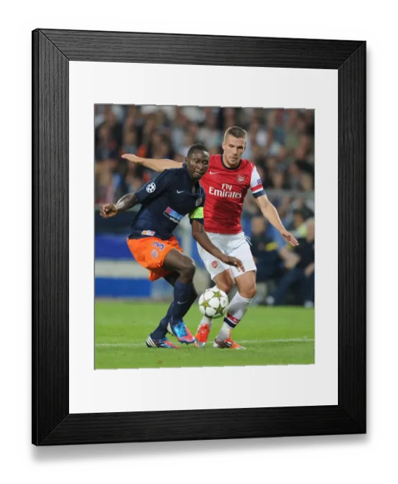 Framed Print : Podolski vs Yanga-Mbiwa: A Champions League Battle Framed Print : Podolski vs Yanga-Mbiwa: A Champions League Battle