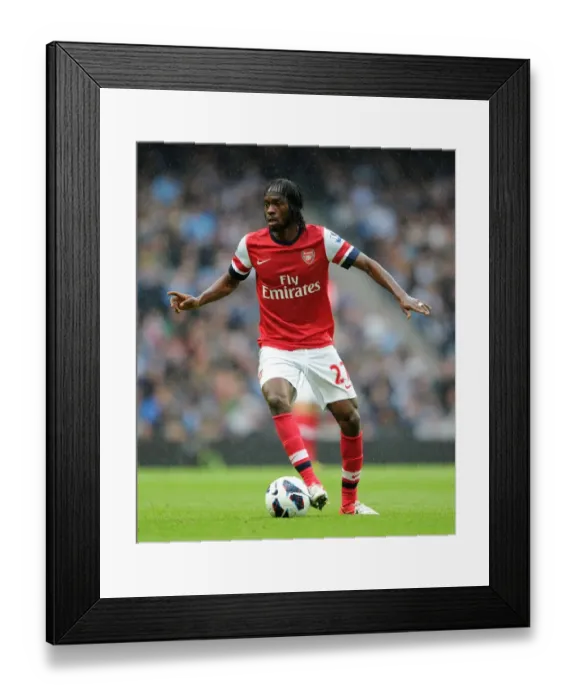 Framed Print : Gervinho's Battle at Etihad: Manchester City vs. Arsenal - Premier League 1:1 Stalemate