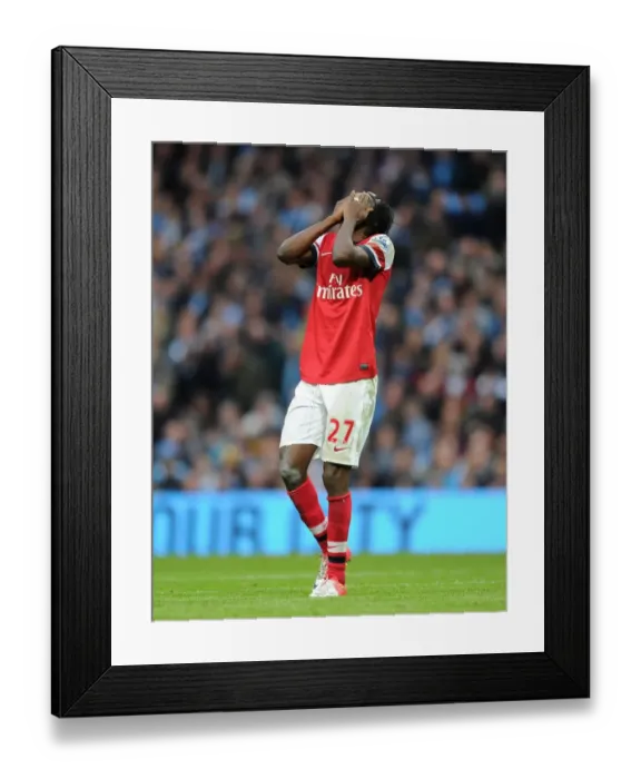 Framed Print : Gervinho's Battle at Etihad: A 1-1 Draw in Manchester City vs. Arsenal Premier League Clash