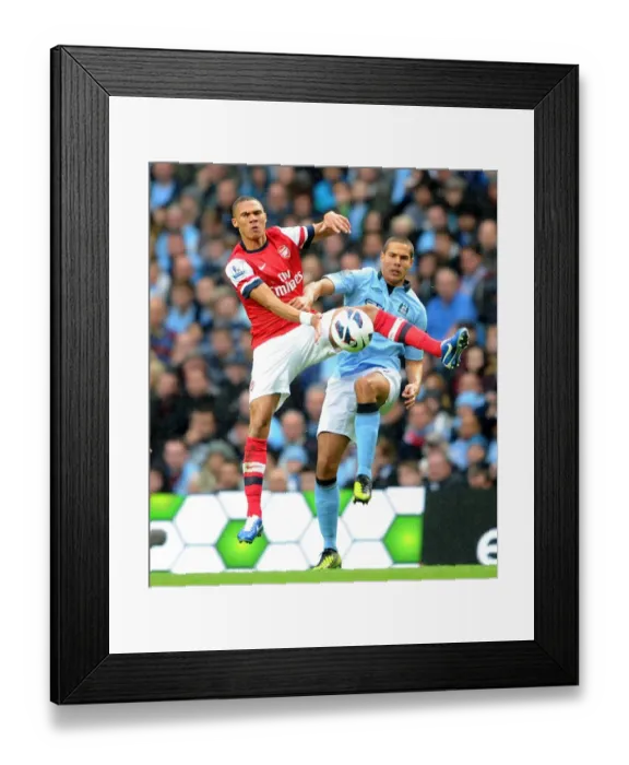 Framed Print : Manchester City vs Arsenal: Kieran Gibbs vs Jack Rodwell - The Battle at Etihad Stadium (1:1)