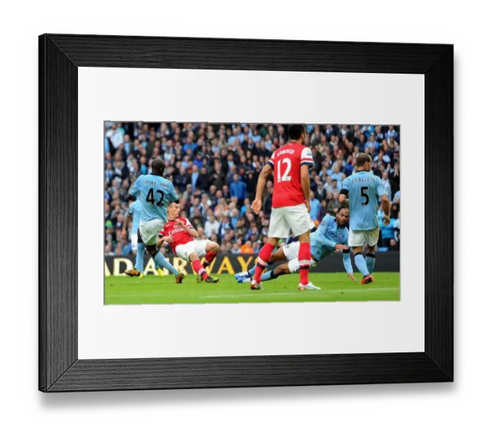 Framed Print : Koscielny Strike: Manchester City vs. Arsenal - Premier League's 1-1 Thriller at Etihad Stadium