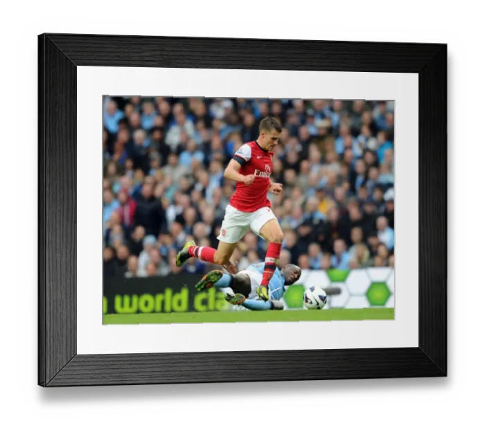 Framed Print : Ramsey vs Toure: A Riveting Rivalry in Manchester City vs Arsenal's Premier League Draw (2012)