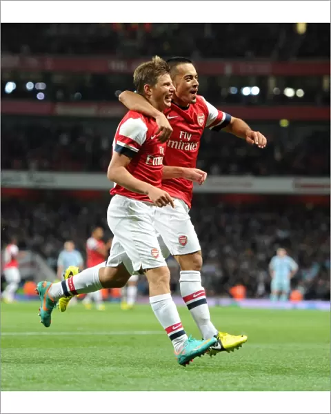 Andrey Arshvin celebrates scoring Arsenals 3rd goal with Nico Yennaris