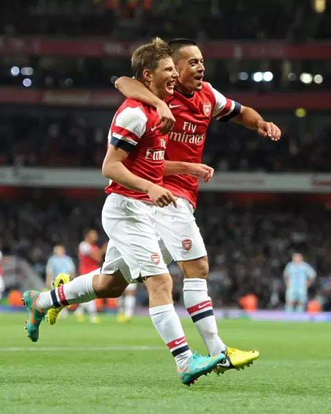 Andrey Arshvin celebrates scoring Arsenals 3rd goal with Nico Yennaris