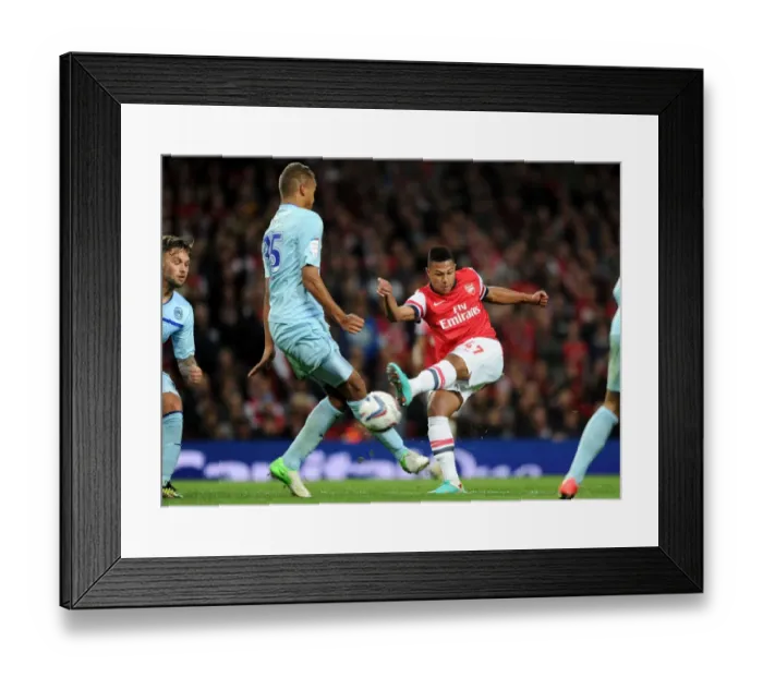 Framed Print : Serge Gnabry vs Reece Brown: Intense Moment at Arsenal v Coventry City - Capital One Cup 2012-13