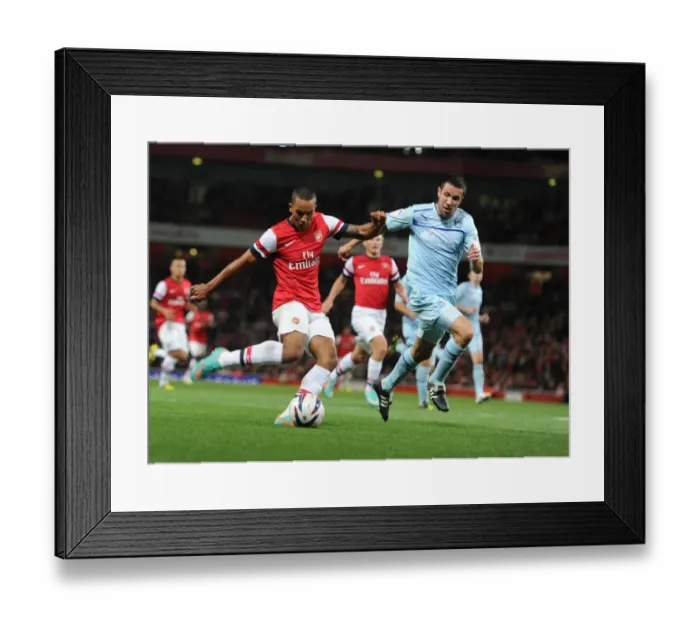 Framed Print : Theo Walcott's Brace: Arsenal Crushes Coventry City in Capital One Cup