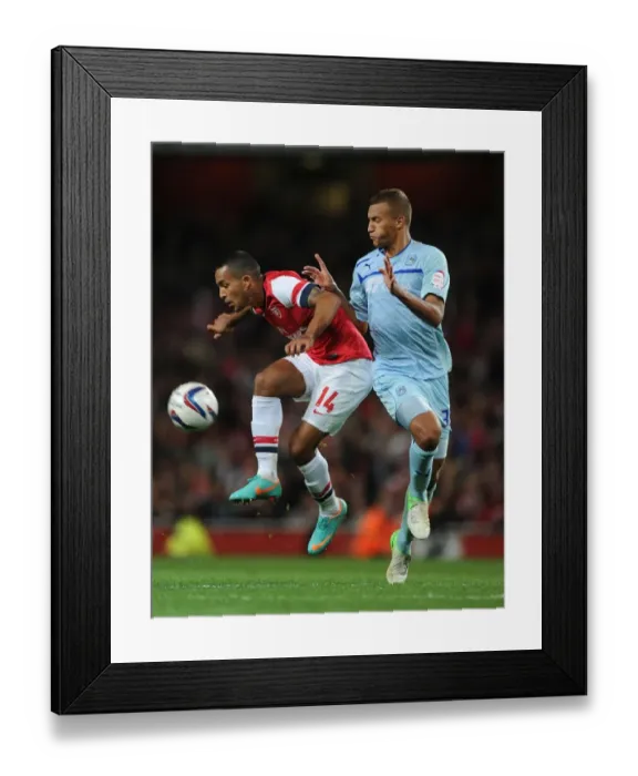 Framed Print : Theo Walcott vs Reece Brown: Arsenal vs Coventry City - Capital One Cup Clash