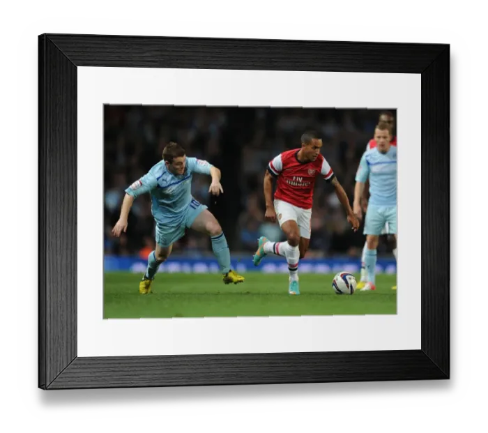 Framed Print : Theo Walcott Outmaneuvers John Fleck in Arsenal's Capital One Cup Victory Framed Print : Theo Walcott Outmaneuvers John Fleck in Arsenal's Capital One Cup Victory
