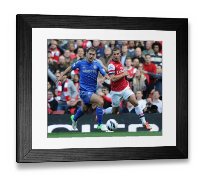 Framed Print : Arsenal's Podolski Outmaneuvers Chelsea's Ivanovic in 2012-13 Premier League Clash