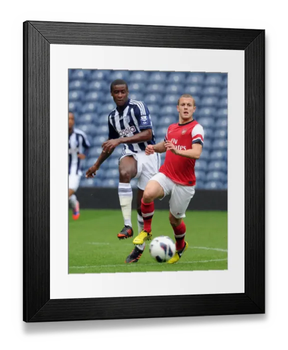 Framed Print : Jack Wilshere (Arsenal) Donervon Daniels (WBA). West Bromwich Albion U21 1: 0 Arsenal U21