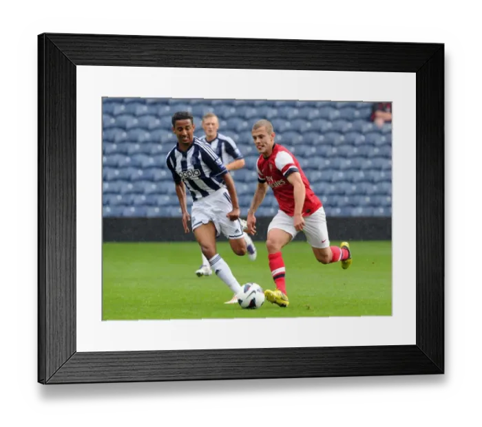 Framed Print : Clash of the Young Prodigies: Jack Wilshere vs Mani O'Sullivan in Arsenal's U21 Triumph over West Bromwich Albion Framed Print : Clash of the Young Prodigies: Jack Wilshere vs Mani O'Sullivan in Arsenal's U21 Triumph over West Bromwich Albion