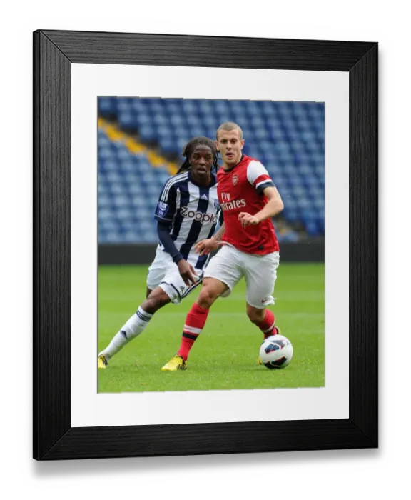 Framed Print : Jack Wilshere vs. Romaine Sawyers: Clash of the Young Stars in Arsenal U21 vs. West Bromwich Albion U21 (2012-13)