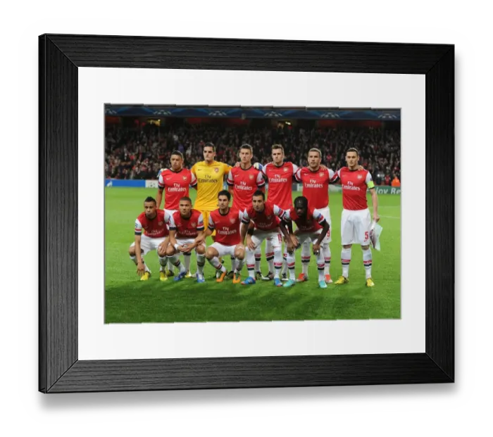 Framed Print : Arsenal FC vs Olympiacos FC - UEFA Champions League Showdown at Emirates Stadium (2012-13)