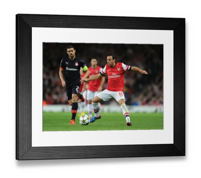 Framed Print : Santi Cazorla vs. Giannis Maniatis: Arsenal FC vs. Olympiacos FC - UEFA Champions League Showdown