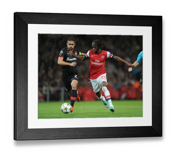Framed Print : Arsenal Triumphs Over Olympiacos: Gervinho's Brace Leads 3-1 Victory in Champions League Group B
