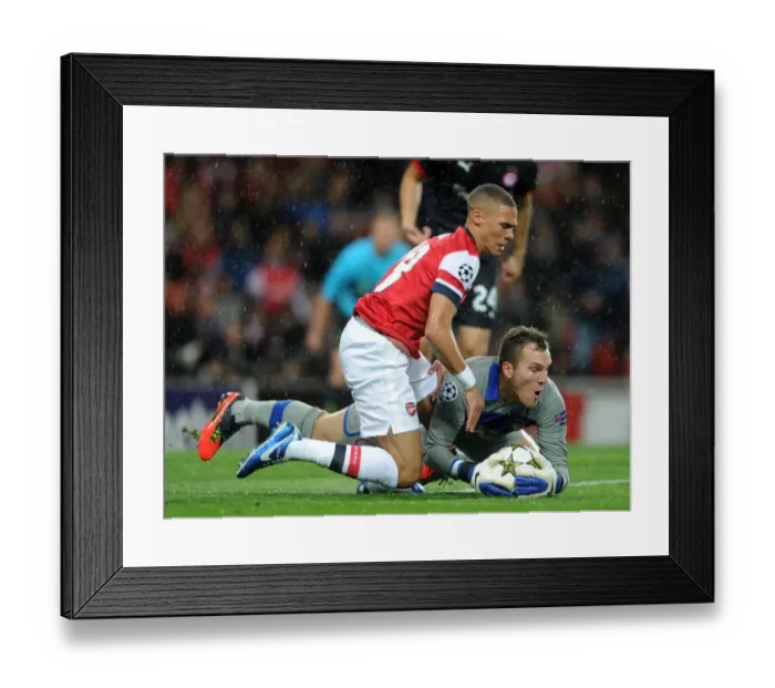 Framed Print : Arsenal's Triumph: 3-1 Victory Over Olympiacos in UEFA Champions League Group B (2012)