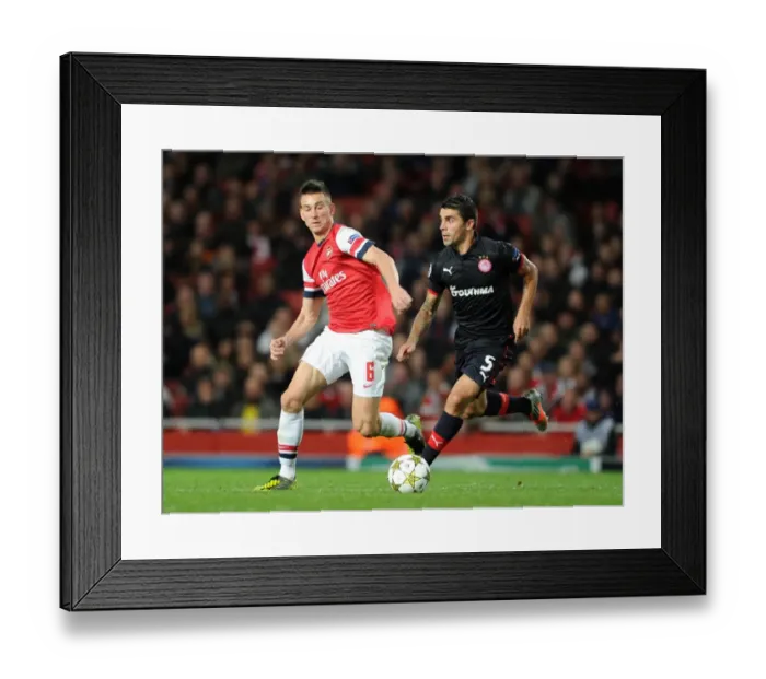 Framed Print : Arsenal's Triumph: 3-1 Victory Over Olympiacos in UEFA Champions League (2012)