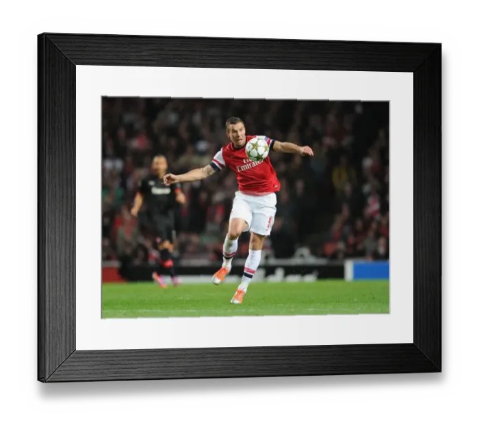 Framed Print : Arsenal's Lukas Podolski Scores in 3-1 Victory over Olympiacos in UEFA Champions League Group Stage at Emirates Stadium